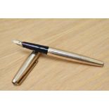 A Parker 65 Insignia converter fountain pen in rolled gold (double jewelled) having Parker 14K