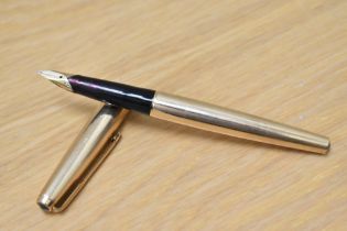 A Parker 65 Insignia converter fountain pen in rolled gold (double jewelled) having Parker 14K