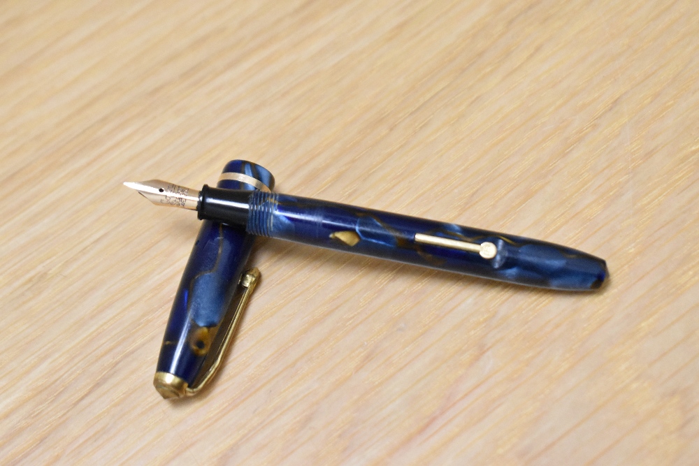 A Conway Stewart Dinkie 550 lever fill fountain pen in Blur/bronze marble with single band to the - Image 2 of 3