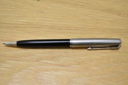 A Parker 51 propelling pencil in black with lustraloy cap. engraved
