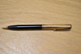 A Parker 51 propelling pencil in black with gold filled cap