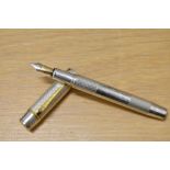 An Onoto University of Cambridge limited edition fountain pen 1/200 in solid sterling silver, with