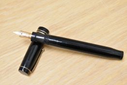A Parker Duofold Lucky Curve Snr button fill fountain pen in black with two narrow bands to the