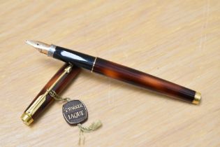 A Parker 75 converter fill fountain pen in tortoiseshell laque having Parker 585 France nib