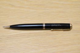 A Parker Vacumatic propelling pencil in black with three narrow bands. Engraved