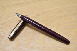 A Sheaffer Imperial III touchdown fill fountain pen in burgundy with broad band to base of the cap