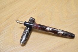 A Conway Stewart 75 lever fill fountain pen in brown/black marble with single band to the cap having