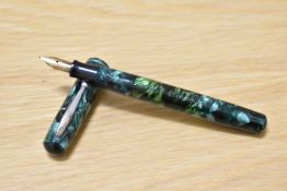 A Waterman Junior lever fill fountain pen in green marble with single narrow band to the cap