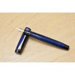 A Parker Streamlined Duofold button fill fountain pen in Lapis blue with two bands to the cap having