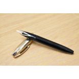 A Sheaffer Pen for Men V snorkel fill fountain pen in black with a rolled gold cap having a Sheaffer