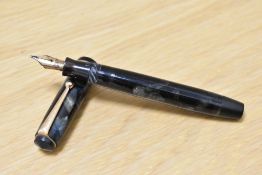 A Parker Premiere button fill fountain pen in black and grey marble with single narrow band to the