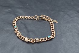 A yellow metal curb link bracelet having turquoise & seed pearl decoration, approx 5.5g