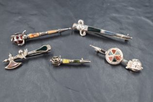 Four Scottish/Celtic silver dirk brooches all having mixed agate decoration, and a similar axe