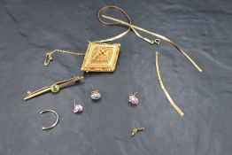 A selection of 9ct gold and yellow metal including Etruscan style brooch, bar brooch with peridot,