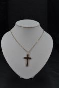 An Edwardian 9ct rose gold cross and chain having floral & foliate engraved decoration, chain approx