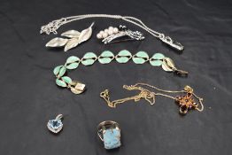 A small selection of silver and white metal jewellery including brooches, ring, pendant, Swarovski