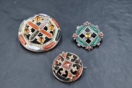 Three Scottish/Celtic white metal brooches of circular form all having mixed polished agate