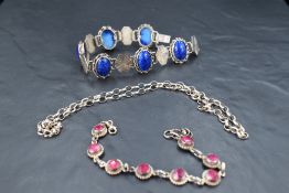 A white metal articulated bracelet stamped 800 having six lapis lazuli cabochon panels