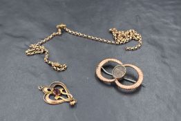 Three pieces of yellow metal jewellery including pendant, broken chain and brooch with central