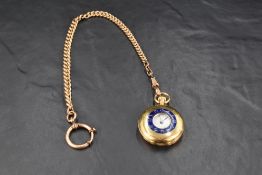 A small 18ct gold half hunter top wound pocket watch having Roman numeral dial to white enamelled