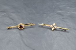 Two yellow metal bar brooches, both stamped 15ct, one having blue paste and seed pearl decoration,