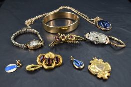A selection of yellow metal items, most plated including hinged bangle, Gruen watch (American),