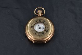 A 9ct rose gold half hunter top wound pocket watch having Roman numeral dial with subsidiary seconds