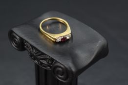 A diamond and ruby trilogy ring having three equal stones, each approx 0.128ct in a claw set mount