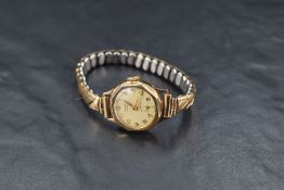 A lady's vintage 9ct gold wrist watch by Centaur having Arabic numeral dial with subsidiary