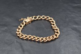 A yellow metal curb link bracelet having concealed clasp, no marks, approx 7.5' & 13.2g