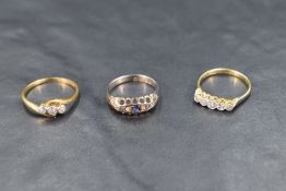 Three 18ct gold rings, each having diamond chip decoration, one also having small sapphires,
