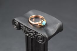A 9ct rose gold signet ring having turquoise cabochon in a gypsy mount, size Q & approx 3g