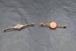 Two yellow metal bar brooches, both stamped 9ct, one having blue paste decoration, the other