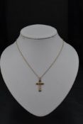 A 9ct rose gold cross pendant on a yellow metal chain with replacement clasp, approx 16' & 2.4g