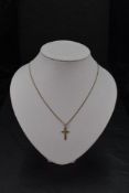 A 9ct gold cross pendant with chain, approx 18' chain & 3.4g