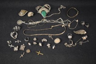 A tray of silver and white metal jewellery including brooches, rings, marcasite, chains and