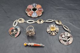 A selection of white metal jewellery including polished stone brooches, bracelet etc, most pieces
