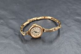 A lady's 9ct gold vintage wrist watch by Pinnacle having Arabic numeral dial in circular case with