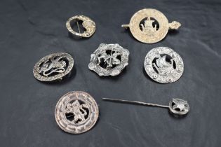 Five Scottish/Celtic silver brooches of traditional style, another similar stamped sterling silver