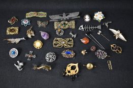 A selection of vintage costume brooches and buckles including Scottish, ceramic, enamelled etc