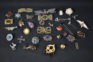 A selection of vintage costume brooches and buckles including Scottish, ceramic, enamelled etc