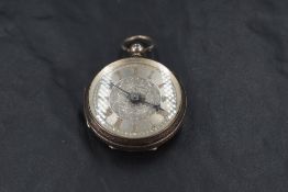A small Victorian key wound silver pocket watch having Roman numeral dial to decorative silvered