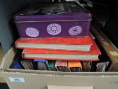 BOX WITH 11 WORLD STAMP COLLECTIONS + TIN OF LOOSE, COVERS ETC Box with 11 mixed world stamp
