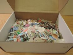 BOX OF WORLD STAMPS OFF PAPER IN OLD BOX, ALL ERAS MINT AND USED Old box with mass of off paper