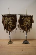 Two 19th Century gilt metal mounted ladies silk face shields, each measuring 52cm tall