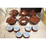 Six Deby soup dishes with lids in brown and blue colourway, and six pinch pots.