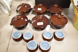 Six Deby soup dishes with lids in brown and blue colourway, and six pinch pots.