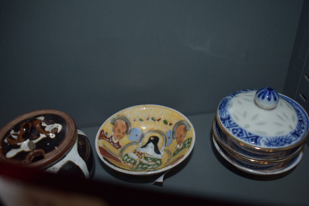 A selection of oriental ceramics,including tea bowls, and miniature cups, some of which are housed - Image 4 of 5