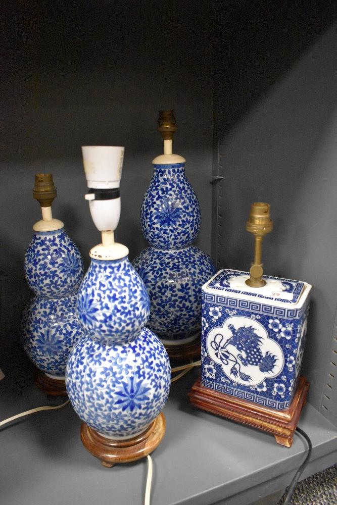 A 20th Century Chinese blue and white porcelain converted table lamp, decorated with a dragon and