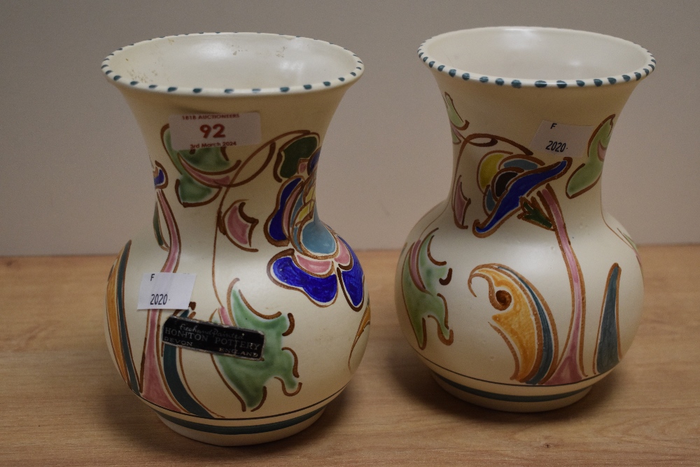 A pair of Hanpainted Honiton Pottery, Devon Art Deco vases, having abstract floral designs.